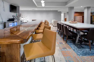 a large dining room with a long table and chairs at Fairfield by Marriott Inn and Suites Boulder Broomfield Interlocken in Broomfield