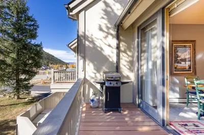 a grill on the porch of a house at 2985 Ironwood Townhomes in Keystone