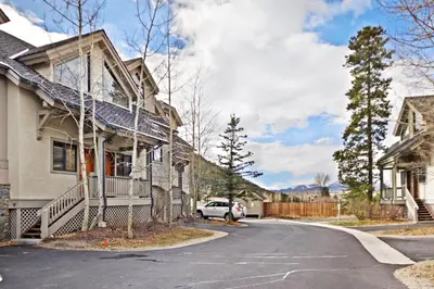 a house with a car parked on the side of the road at 2985 Ironwood Townhomes in Keystone