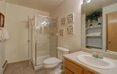 a bathroom with a shower and a toilet and a sink at A5 Gore Trail Condo in Silverthorne
