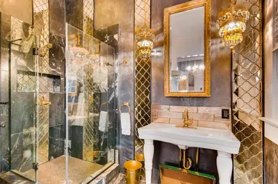 a bathroom with a sink and a shower at The Holiday Chalet Victorian in Denver