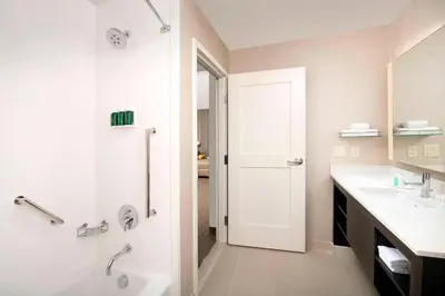 a bathroom with a shower and a sink at Residence Inn by Marriott Denver Airport/Convention Center in Denver