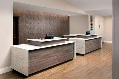 a row of reception desks in an office at Residence Inn by Marriott Denver Airport/Convention Center in Denver