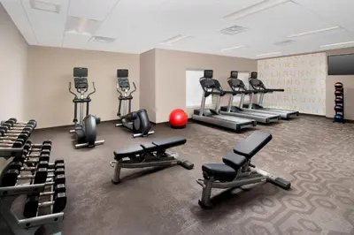 a gym with several treadmills and exercise bikes at Residence Inn by Marriott Denver Airport/Convention Center in Denver