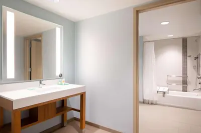 a bathroom with a sink and a mirror at Hyatt Place Westminster Denver in Westminster