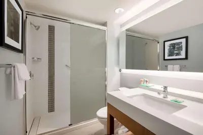 a bathroom with a sink and a shower at Hyatt Place Westminster Denver in Westminster