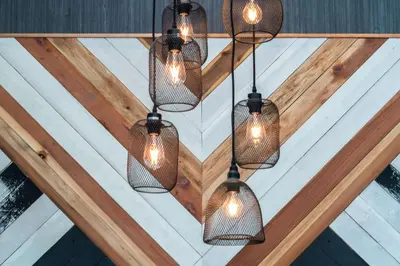a group of lights hanging from a ceiling at Hyatt Place Westminster Denver in Westminster