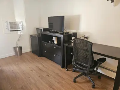 an office with a desk with a computer and a chair at H&H Motor Lodge in Idaho Springs