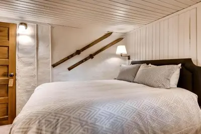 a bedroom with a large bed in a room at Ski Tip Lodge, A Vail Resorts Property in Keystone