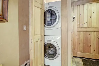 a washer and dryer in a room with a door at 2609 Tenderfoot Lodge Condo in Keystone