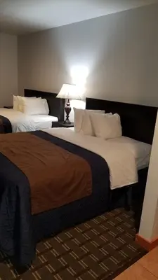 two large beds in a hotel room with at Valley Hi Hotel in Winter Park