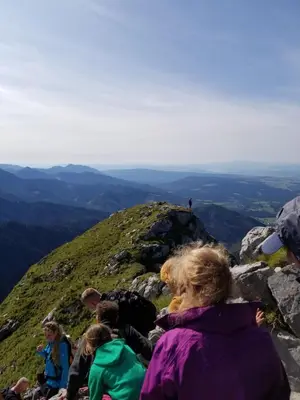 a group of people sitting on top of a mountain at Valley Hi Hotel in Winter Park