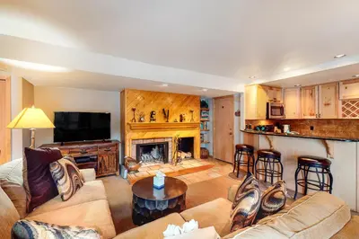 a living room with a couch and a fireplace at Wild I rishman 1003 in Keystone