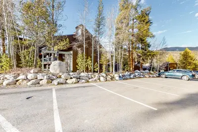 a car parked in a parking lot in front of a building at Wild I rishman 1003 in Keystone