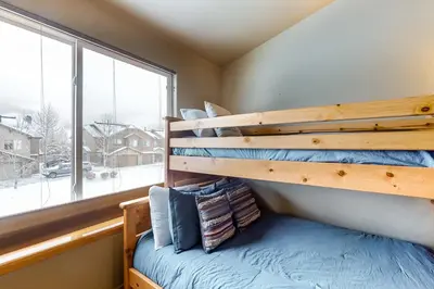 a bedroom with a bunk bed and a window at Silverthorne Sanctuary in Silverthorne