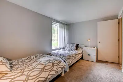 a bedroom with two beds and a window at Sts, Johns 2507 in Keystone