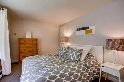 a small bedroom with a bed and a dresser at Sts, Johns 2507 in Keystone