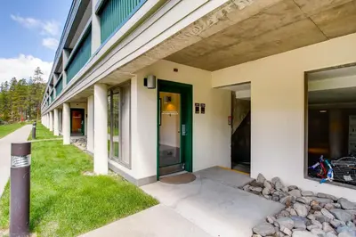 a building with a green door on the side of it at Sts, Johns 2507 in Keystone