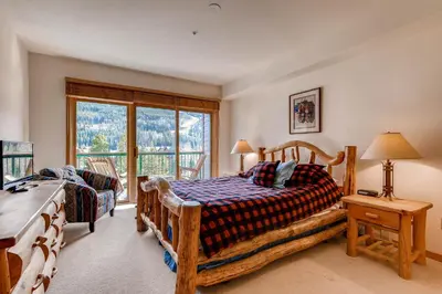 a bedroom with a bed and a large window at Gateway 5039 in Keystone