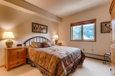 a bedroom with a bed and a window at Gateway 5039 in Keystone