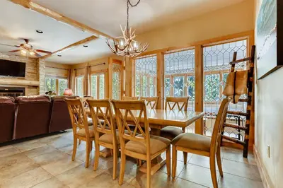 a dining room with a table and chairs at Chateaux DuMont 2724 in Keystone