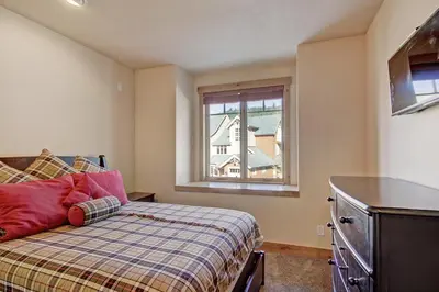 a bedroom with a bed and a window at 6508 Settlers Creek Townhomes in Keystone
