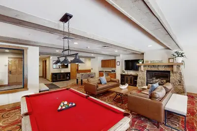 a large living room with a pool table at Red Hawk Lodge 2254 in Keystone