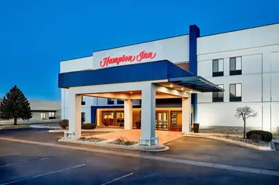 a hampton inn sign on the front of a building at Hampton Inn Longmont in Longmont