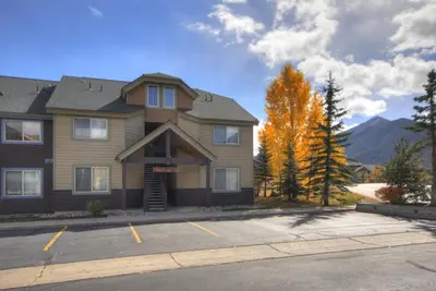 a house with a parking lot in front of it at Tarn Landing C-19 Condo in Frisco
