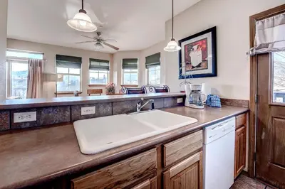 a kitchen with a sink and a counter top at Tarn Landing C-19 Condo in Frisco