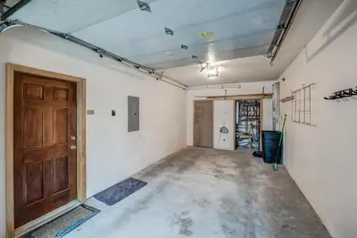 an empty room with a wooden door in a building at Streamside 333B Townhouse in Frisco