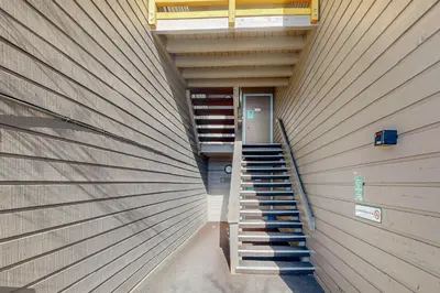 a building with a staircase in the middle of it at Treehouse 202 in Silverthorne