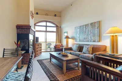 a living room with a couch and a table at Dillon Commons Studio in Dillon