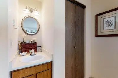 a bathroom with a sink and a mirror at Buffalo Ridge 205 in Silverthorne