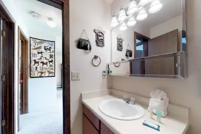 a bathroom with a sink and a mirror at Buffalo Ridge 205 in Silverthorne