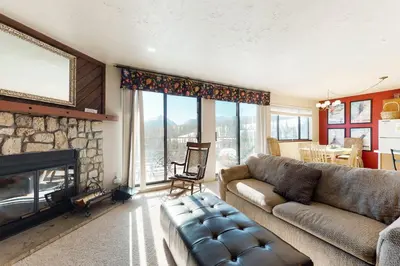 a living room with a couch and a fireplace at Buffalo Ridge 205 in Silverthorne