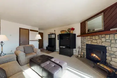a living room with a couch and a fireplace at Buffalo Ridge 205 in Silverthorne