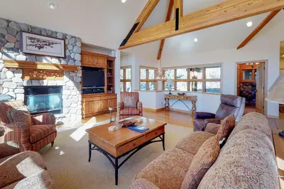 a living room with a couch and a fireplace at Aspen View in Silverthorne