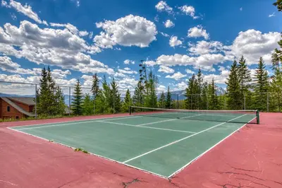 a tennis court with a tennis net on it at Buffalo Village 402 in Silverthorne