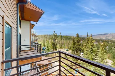 a balcony with a view of the mountains at Buffalo Village 402 in Silverthorne