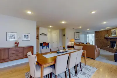 a dining room and living room with a table and chairs at Alpine Getaway in Gold Hill
