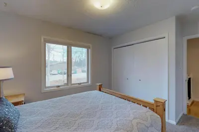 a bedroom with a bed and a window at Alpine Getaway in Gold Hill