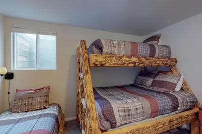 a bedroom with two bunk beds in a house at Alpine Getaway in Gold Hill
