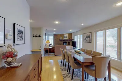a kitchen and dining room with a table and chairs at Alpine Getaway in Gold Hill