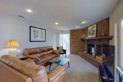 a living room with a couch and a fireplace at Alpine Getaway in Gold Hill