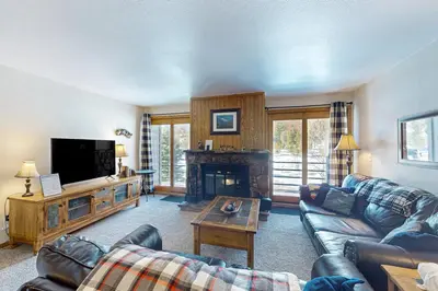 a living room with a couch and a fireplace at Buffalo Village 306 in Silverthorne
