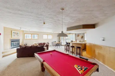 a living room with a red pool table in it at East Bay 6 in Dillon