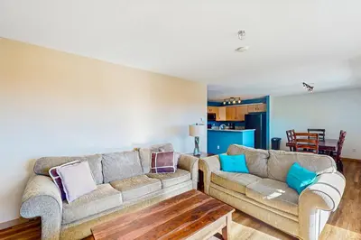 a living room with two couches and a table at Watch Hill in Silverthorne
