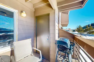 a stroller sitting on the balcony of a house at Watch Hill in Silverthorne