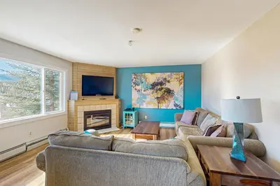 a living room with two couches and a tv at Watch Hill in Silverthorne